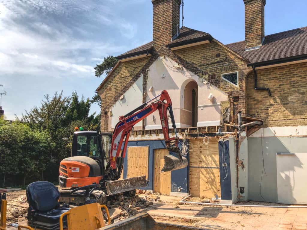 Digger demolishes extension on Ginnels House, Petersham