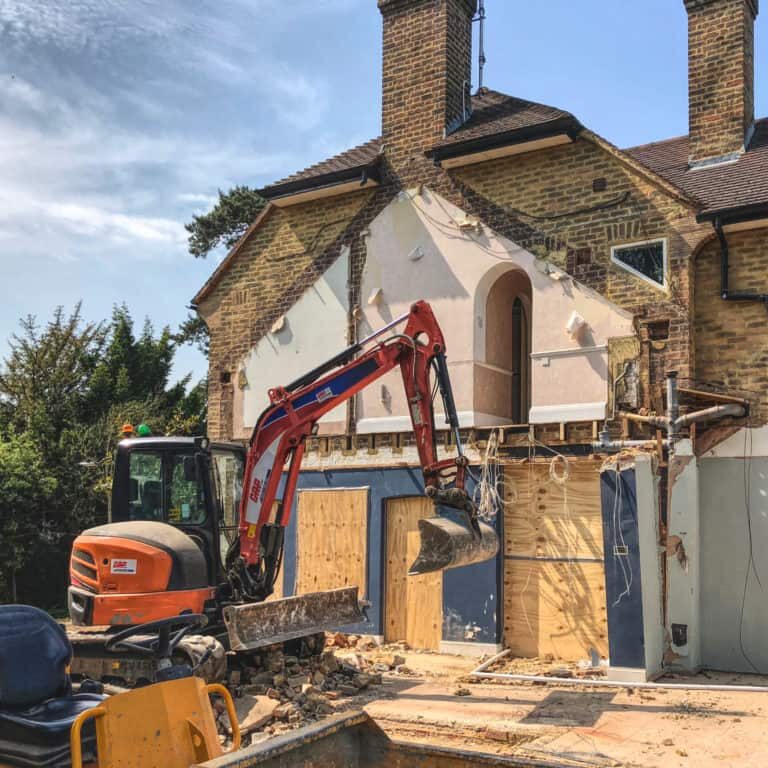 Digger demolishes extension on Ginnels House, Petersham